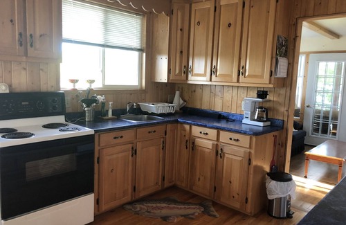 North Frontenac Cabaña | Well equipped bright family cottage . Amazing swimming, fishing and boating.