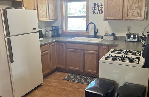 Rhinelander Cabaña | WI River-Boom Lake cottage on spacious lot, water on 3 sides, kayaks, fire pit