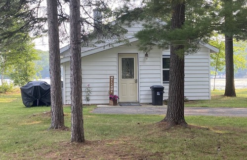 Rhinelander Cabaña | WI River-Boom Lake cottage on spacious lot, water on 3 sides, kayaks, fire pit