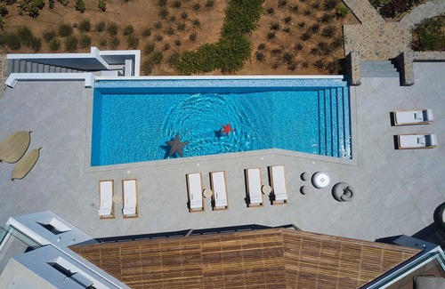 Ammoudara Villa | Wonderful Crete Villa | Seafront Villa Seraphis | 6 Bedrooms | Private Heated Pool | Fitness Area & Cinema Room | Outdoor Dining Area & BBQ | Direct Access to Rocky Beach | Agios Nikolaos