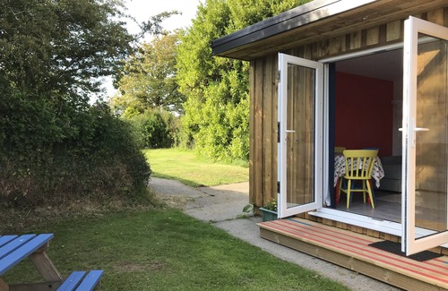 Stenalees Cabina | Woodpecker - our cosy, spacious glamping cabin at Mena Farm, Cornwall