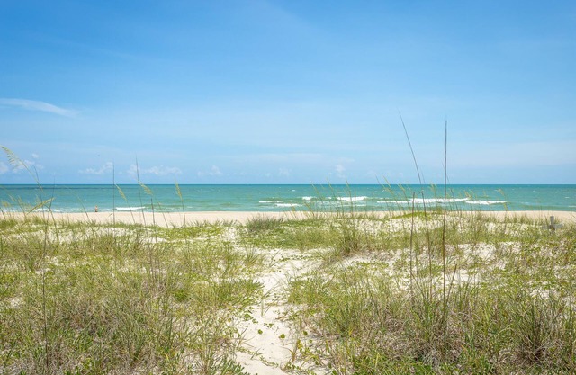 July dates still available! Beachfront, ground level apartment screened porch.