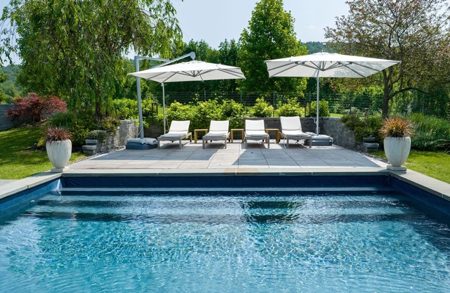 4 bedroom house with a heated pool