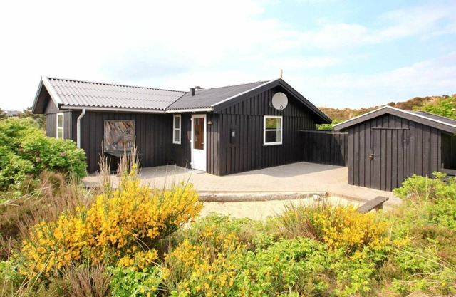 Casa de vacaciones moderna en Henne con sauna