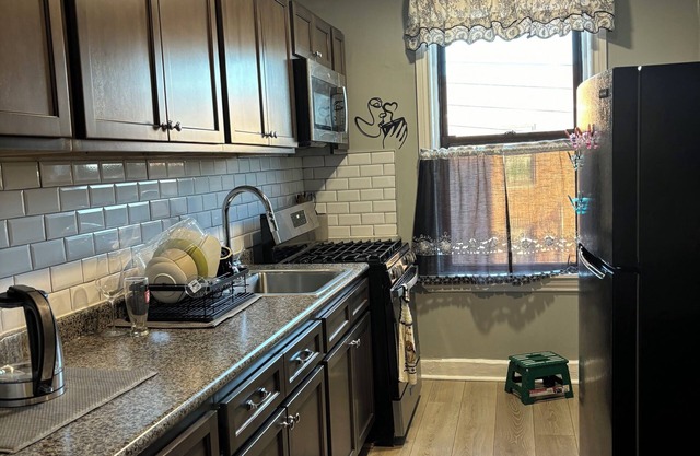A charming comfy apartment with bright lights and lots of sunlight.