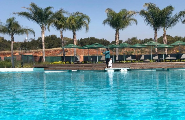 A Coastal/island experience at a Large 2 bed apartment at a Crystal Lagoon Estate.