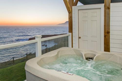 Abalone by OceanviewHotTubs Oceanfront Shelter Cove Tesla