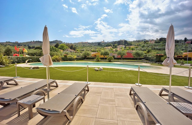 "Appartamento Monolocale Rebi" con piscina compartida, jardín y Wi-Fi