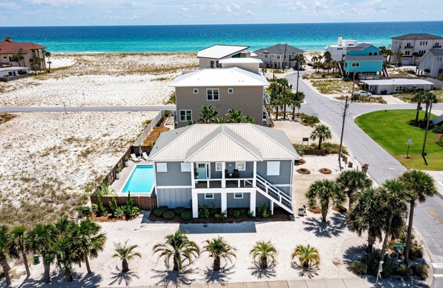 Beach Bungalow Steps from Pensacola Beach and Sound with Salt water heated pool