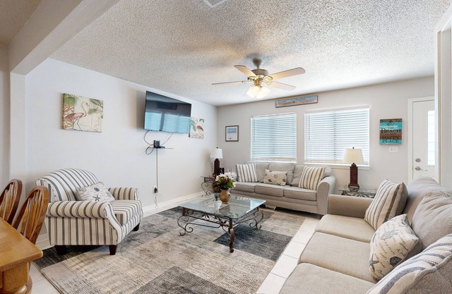 Beachfront townhome w/ on-site beach access, heated pool, patio, grill, AC, W/D