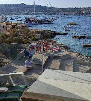 BEACHFRONT with Seaviews Apartment No56 Award Winner Unbeatable Location for Closeness to the Sea Ideal for Guests looking for Winter Spring and Autumn Breaks in Sunny Malta Also Ideal for Coastal Hikers