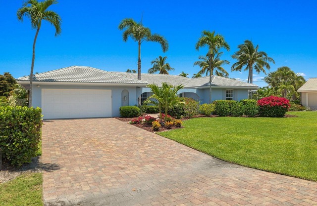 Beautifully newly redesigned canal front pool home minutes to beach! NEW!