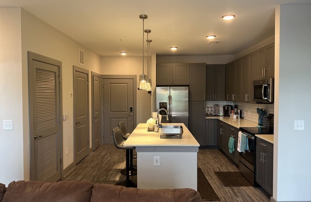 Buckhead Retreat with full access to pool, roooftop, gym and parking garage.