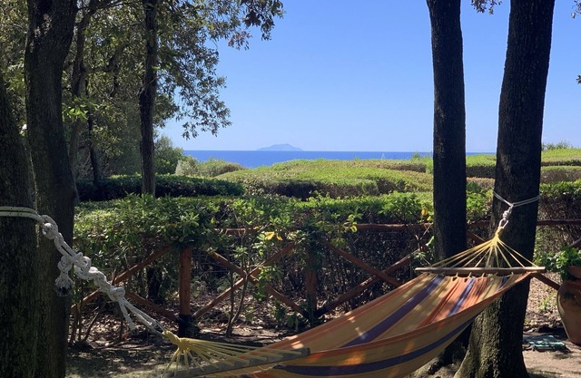 Cala Dei Pirati. Garden cottage with sea view on the Tuscan archipelago