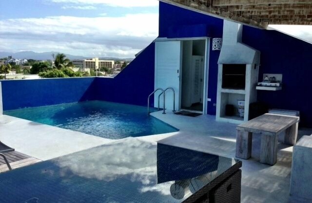 Caribbean Penthouse- Frente a la playa, piscina en la azotea, grupos, HoneyMooners, generador