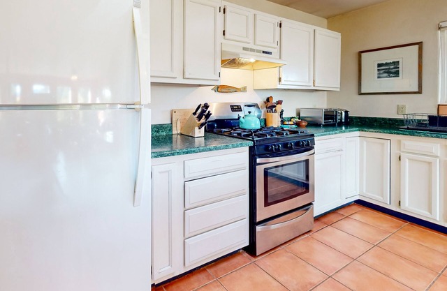 Charming acreage with mountain views, covered front porch, & book collection