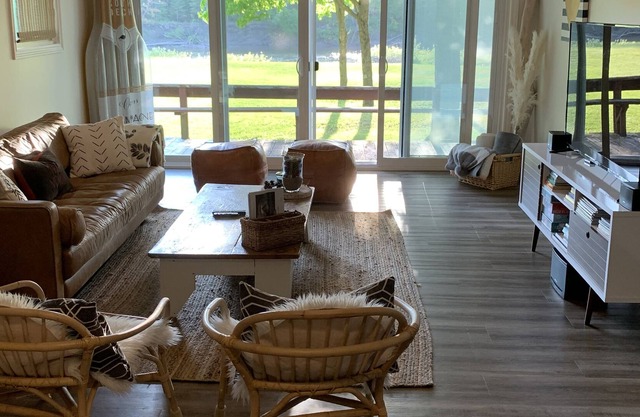 Come stay at a cozy Riverside Retreat with a beautiful sandy beach!