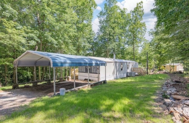 Cozy retreat waterfront on beautiful Lake Gaston with community pool.