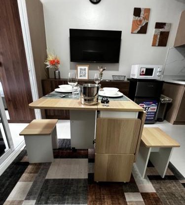 Dagos PrimeWorld condo with balcony and pool view