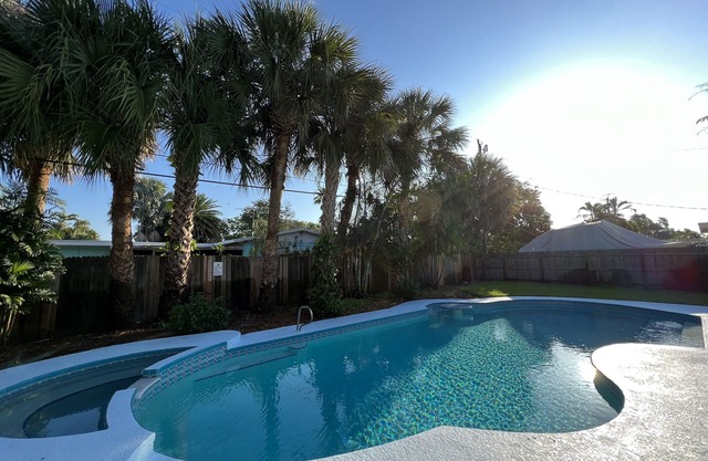 Escape to Paradise! Stunning Poolside Haven Just Moments from the Shore.