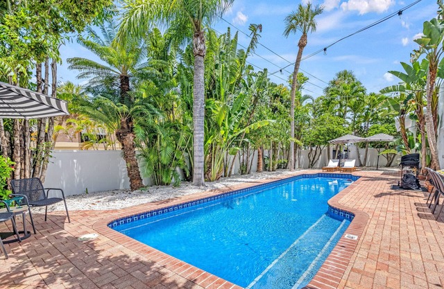 Five Palms Indulge in a Stunning Lido Key Retreat with Private Pool, Firepit, and Steps to the Beach