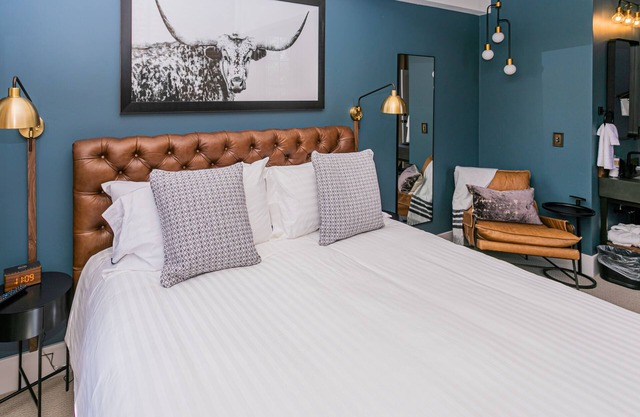 Jacksonville Inn Room #8: King Suite. Prime downtown location for festivals and dining. Comfortable king bed, Nespresso coffee, and historic boutique elegance