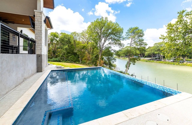 NEW! Lakefront luxury - pool, hot tub, game room, pets, sleeps 30!