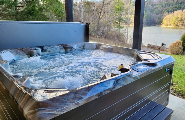 Lakefront Lullaby-Rustic cabin w/ lake views, boatslip, hot tub & fiber internet