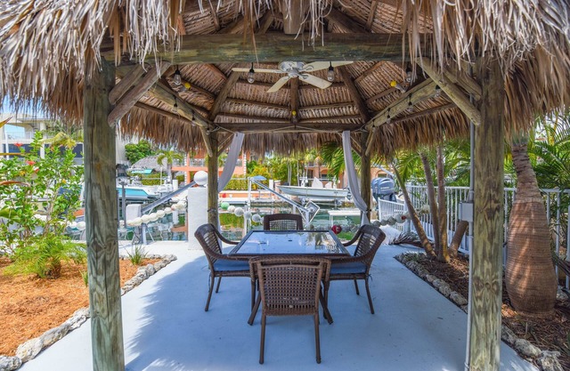 Latitude Adjustment – Canalfront 3BR w/ Hot Tub, Tiki Hut & Boating Access