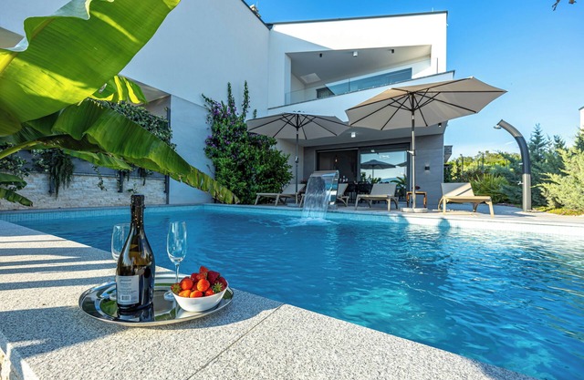 Luxury villa with open sea view and its own multi-purpose sports ground
