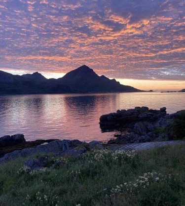 Midnight-sun and Northern-lights house by ocean