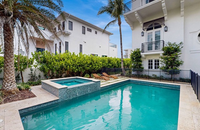 Ocean view estate w/ in ground outdoor pool, breezy terraces, and covered lanai