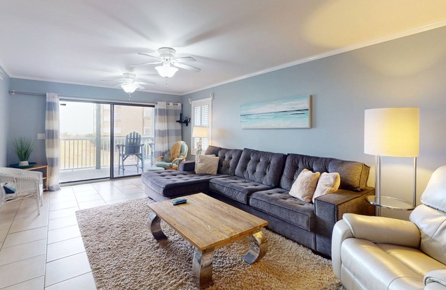 Ocean-view condo with elevator, balcony, W/D, community outdoor pool & grills