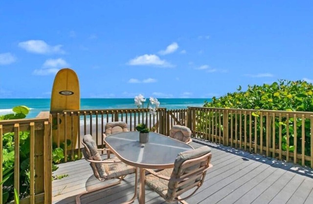 Oceanfront home with solar-heated pool facing the beach