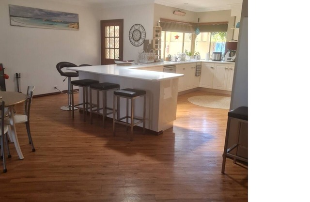 Open plan large home with outdoor patio and kitchen area