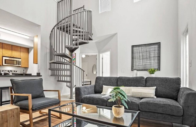 Spiral Stairs to Loft Bedroom + Balcony with Shade