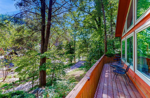 Riverfront home with 228 ft of riverfront access & wraparound deck with views