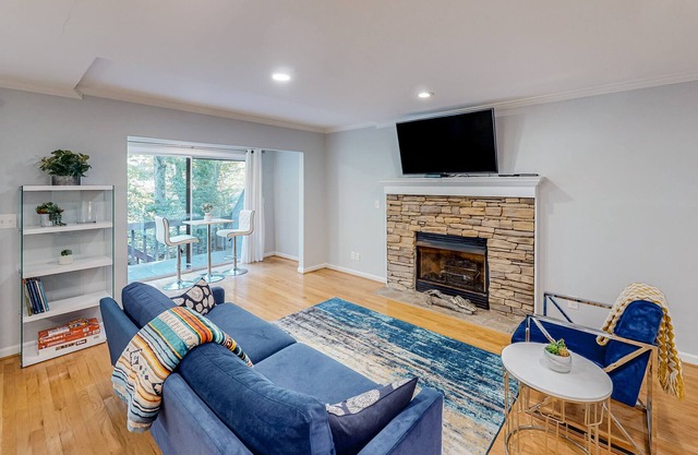 Riverfront townhome with two decks, fireplace, gazebo & woodland views