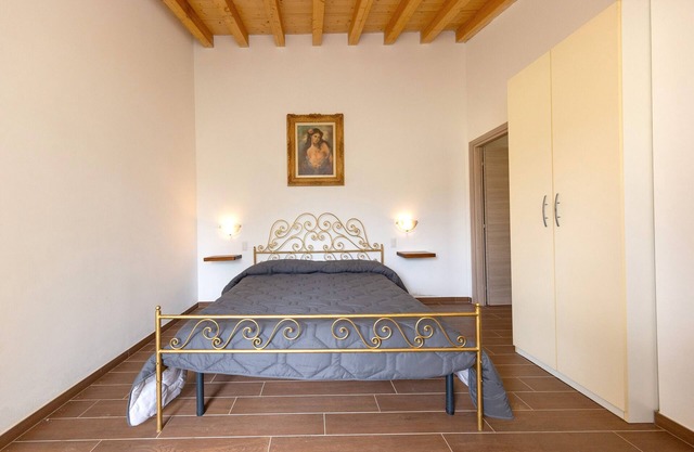 Habitación 'Camera 1' con piscina compartida, jardín compartido y aire acondicionado.