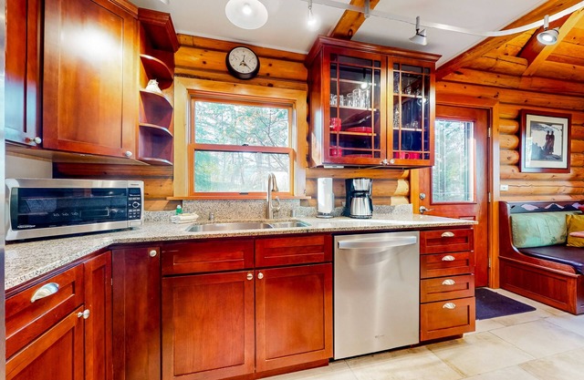 Skagit Bay view acreage with beach access, wrap-around deck, W/D, & fireplace