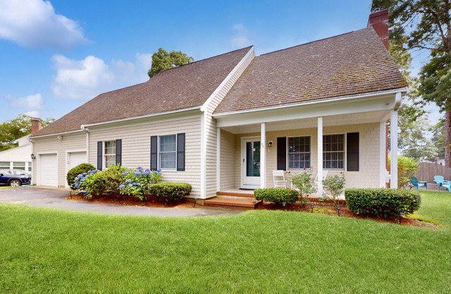 Serene home near the beach with open floor plan, yard, grill, & central AC
