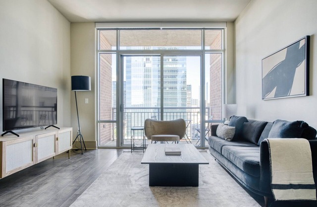 Sleek Downtown 1BR w/ Gym, W/D & Deck, walk to 6th St bars, by Blueground