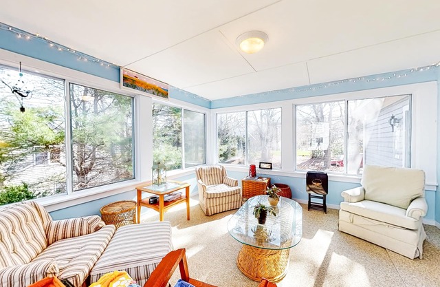 Spacious home on Hinckleys Pond with game room, sunroom & quick access to trail