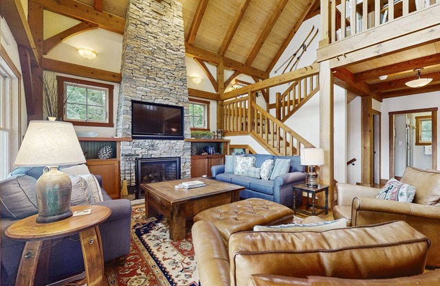 Spectacular lakefront home w/ private dock, beach, swim platform, gazebo & porch