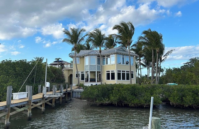 Stunning Riverfront Home with Private Beach and in Close Proximity to the Ocean.