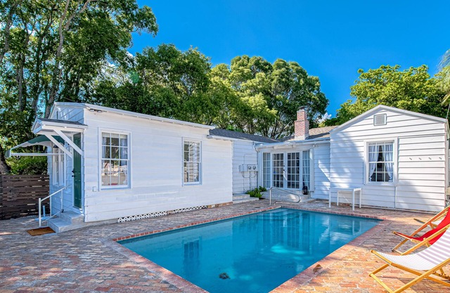 Stylish, dog-friendly home with a pool, enclosed yard, patio, & central AC