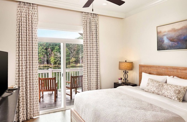 Two-Story Villa Overlooking Lunker Lake w/ Kitchenette, WiFi, & Covered Porch