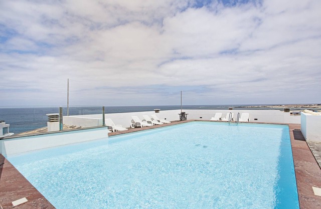 Casa de vacaciones 'Apart 3 Dormitorios Vista Mar 4' con vistas al mar, piscina compartida y Wi-Fi