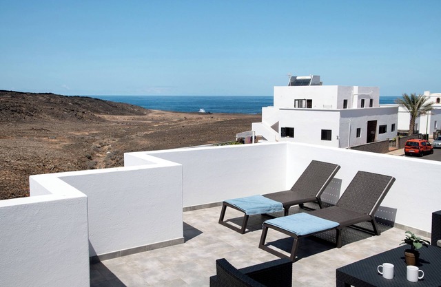 Casa de vacaciones 'Neptuno' con vistas al mar, Wi-Fi y aire acondicionado
