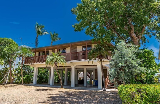 Venetian Shores Retreat with Boat Lift, Tiki Hut & Hot Tub